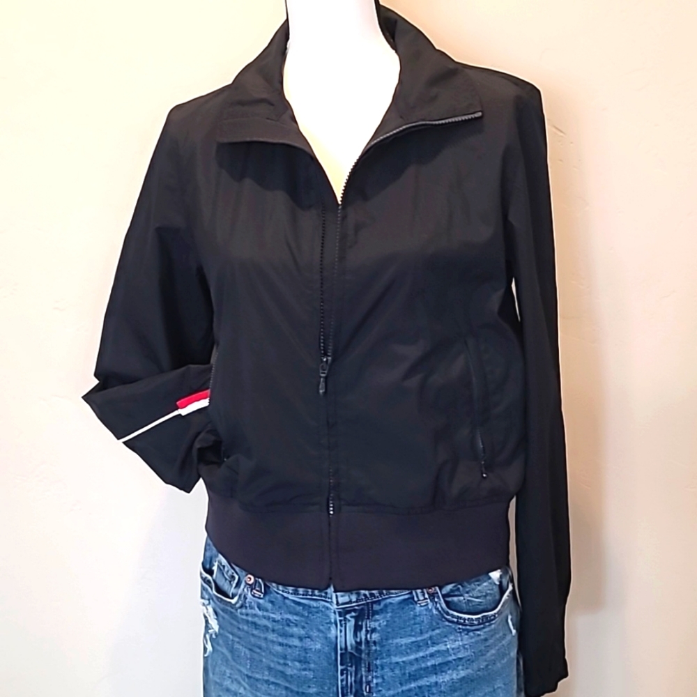 Dark navy blue Tommy Hilfiger windbreaker jacket.